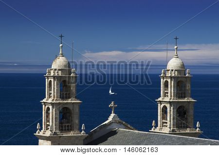 Spain Galicia Muxia Virxen de la Barca Sanctuary on Atlantic coast fishing boat at sea