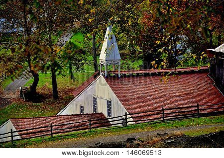 Hopewell Furnace Pennsylvania - October 15 2015: The Cast House with its distinctive wooden roof cupola at Hopewell Furnace National Histotric Site