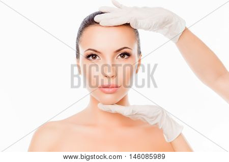 Doctor Checking Woman's Skin Before Plastic Surgery