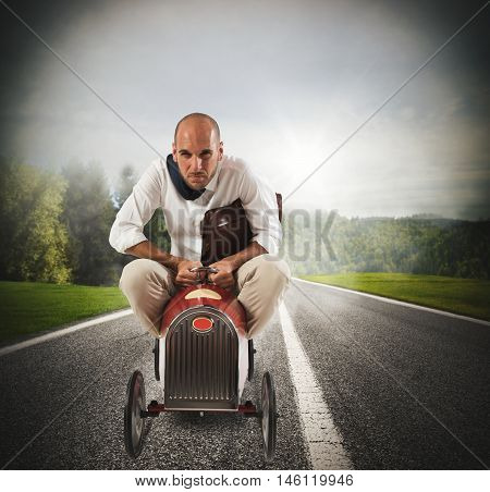 Businessman with bag driving quickly a small car
