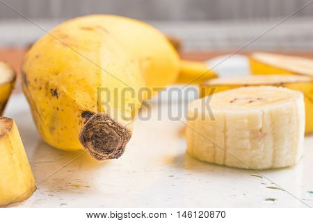 Slices of Banana Prata over a glass table