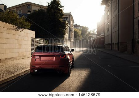 Moscow, Russia - August 06, 2016: Car Land Rover Range Rover Evoque standing on asphalt road in city Moscow at sunset