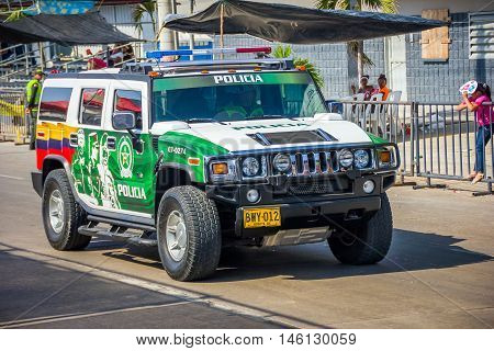 BARRANQUILLA, COLOMBIA - FEBRUARY 15, 2015: Police cars patrolling streets just before Colombia's most important folklore celebration, the Carnival of Barranquilla, Colombia