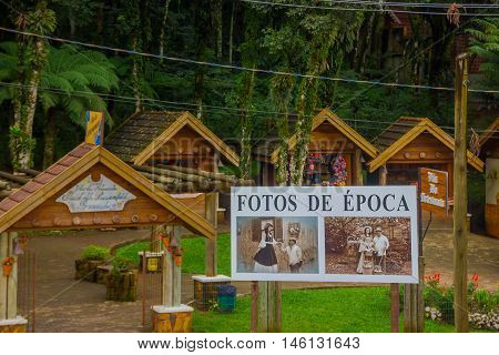 GRAMADO, BRAZIL - MAY 06, 2016: some small stores that offers souvenirs, lot of trees as background.