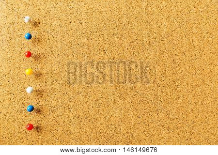 For beautiful background with cork board texture color pins for business or education