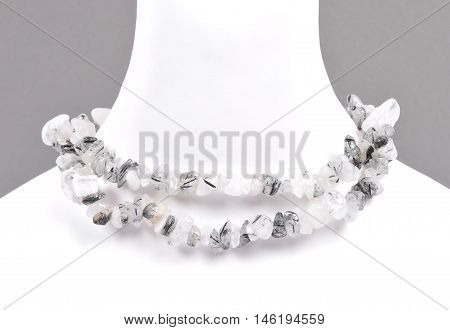 Colorful and crisp image of splintered tourmaline quartz chain on bust