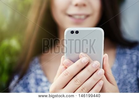 Girl Taking Photo With Modern Dual Camera Smart Phone