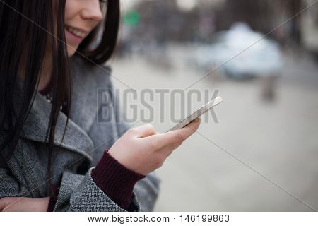 Young White Girl Using Modern Smart Phone