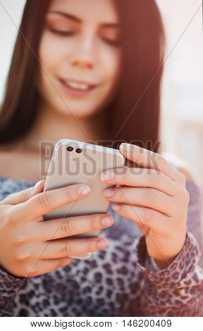 Young Pretty Model Using Modern Dual Camera Smart Phone