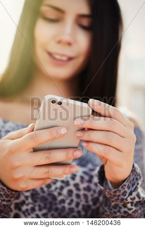 Young Pretty Model Using Modern Dual Camera Smart Phone