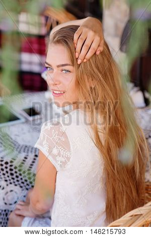 young woman in caffee looking aside. Fashion portrait