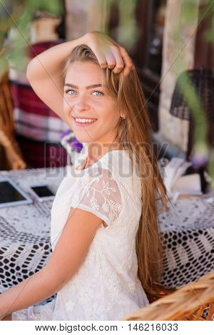 young woman in caffee looking aside. Fashion portrait