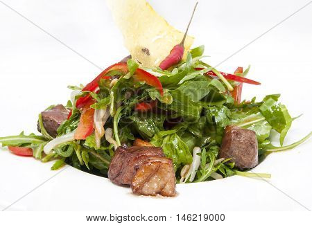 duck with arugula on a white background in the restaurant