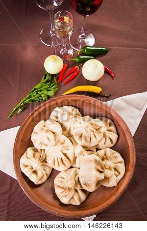 hot fresh georgian food,hinkali with parsley in restaurant