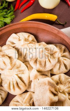 hot fresh georgian food,hinkali with parsley in restaurant