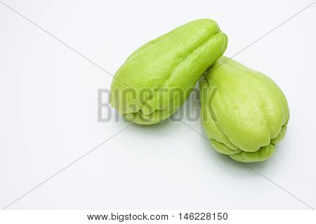 Two fresh Chayote fruits isolated on white background.