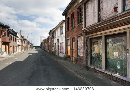 Street in ghost town Doel in Belgium