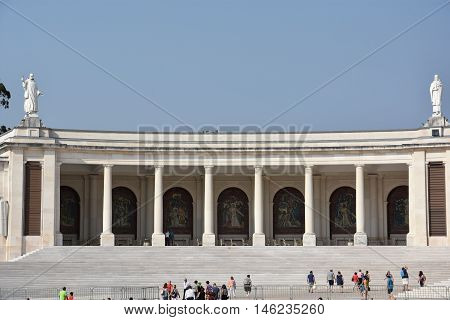 FATIMA, PORTUGAL - AUG 24: Sanctuary of Fatima in Portugal, as seen on Aug 24, 2016. It consists of a tall centralized bell-tower and nave, 213 ft in height, decorated by a 15,000 lb crown of bronze.