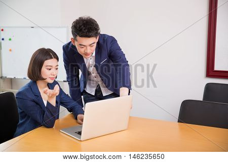 Young Boss And Assistant At Work