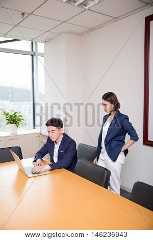 Young Boss And Assistant At Work