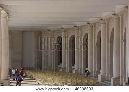 FATIMA, PORTUGAL - AUG 24: Sanctuary of Fatima in Portugal, as seen on Aug 24, 2016. It consists of a tall centralized bell-tower and nave, 213 ft in height, decorated by a 15,000 lb crown of bronze.