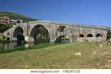 Arslanagica Most over Trebisnjica River in Trebinje Bosnia also known since 1993 as Perovica Bridge. Built by Ottomans in 1574 it was moved and physically rebuilt in 1970 a few kilometres from its orginal location.