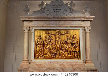 FATIMA, PORTUGAL - AUG 24: Sanctuary of Fatima in Portugal, as seen on Aug 24, 2016. It consists of a tall centralized bell-tower and nave, 213 ft in height, decorated by a 15,000 lb crown of bronze.
