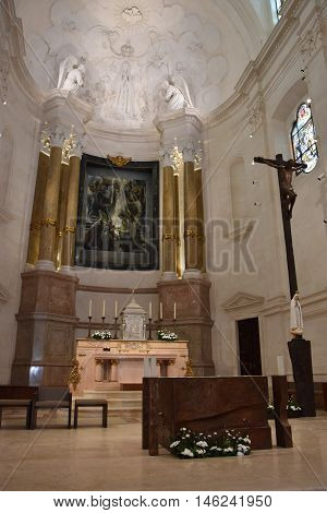 FATIMA, PORTUGAL - AUG 24: Sanctuary of Fatima in Portugal, as seen on Aug 24, 2016. It consists of a tall centralized bell-tower and nave, 213 ft in height, decorated by a 15,000 lb crown of bronze.