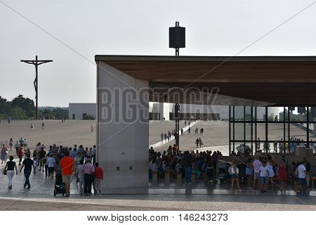 FATIMA, PORTUGAL - AUG 24: Sanctuary of Fatima in Portugal, as seen on Aug 24, 2016. It consists of a tall centralized bell-tower and nave, 213 ft in height, decorated by a 15,000 lb crown of bronze.