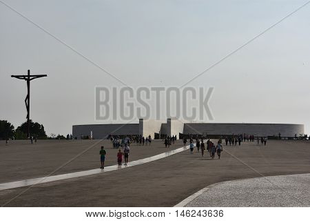FATIMA, PORTUGAL - AUG 24: Sanctuary of Fatima in Portugal, as seen on Aug 24, 2016. It consists of a tall centralized bell-tower and nave, 213 ft in height, decorated by a 15,000 lb crown of bronze.