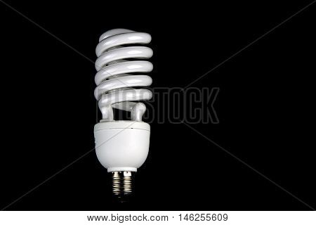 Energy efficient lamp isolated against a black background