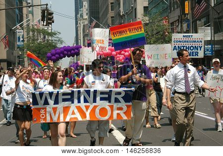 New York City - June 25 2005: U.S. Congressman Anthony Weiner (on right with tie) with his mayoral bid marchers at the 2005 Gay Pride Parade on Fifth Avenue