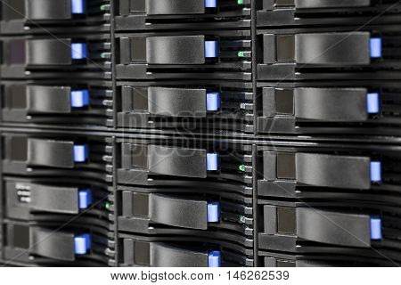 Full frame shot of SAN storage with harddrives in server room