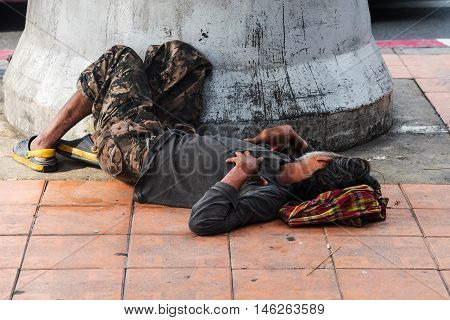 Homeless Man Sleep On Pavement