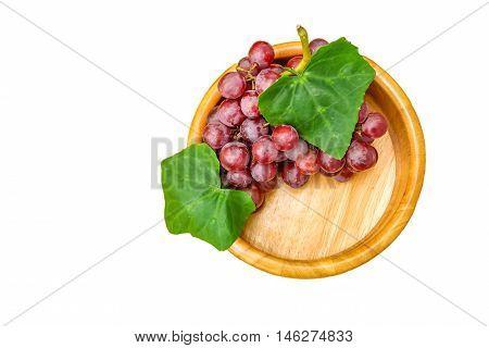 red grapes on basket and white background