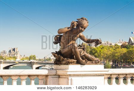 The sculpture of Alexandre III bridge.The bridge is widely regarded as the most ornate extravagant in Paris and classified as Historical monument.