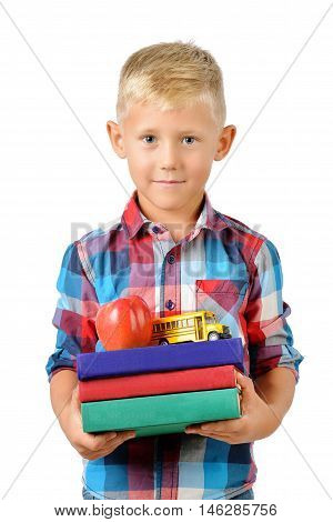 Portrait of happy schoolboy with books and apple isolated on white background. Education isolated. School preschool