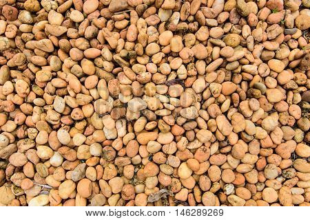 Orange brown rock pebbles for background texture