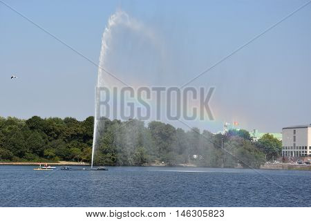 HAMBURG, GERMANY - AUG 26: Fountain at Alster Lake in Hamburg, Germany, as seen on Aug 26, 2016. In the city center, the Alster river forms two lakes, both prominent features in Hamburg's cityscape.