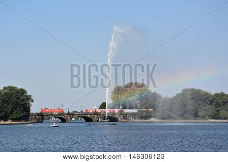 HAMBURG, GERMANY - AUG 26: Fountain at Alster Lake in Hamburg, Germany, as seen on Aug 26, 2016. In the city center, the Alster river forms two lakes, both prominent features in Hamburg's cityscape.