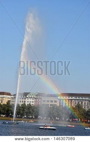 HAMBURG, GERMANY - AUG 26: Fountain at Alster Lake in Hamburg, Germany, as seen on Aug 26, 2016. In the city center, the Alster river forms two lakes, both prominent features in Hamburg's cityscape.