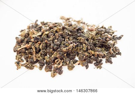 Tea dry leaves on isolated background little