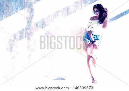 Fashion Portrait Of Young Model Posing By The Wall