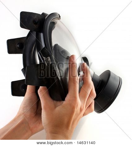 Holding A Black Gas Mask In Hands