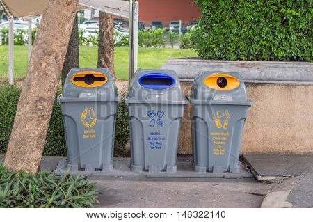 Bins for collection of recycle materials. In park