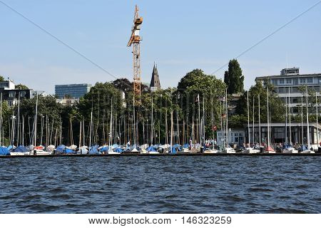 HAMBURG, GERMANY - AUG 26: Sailboats on Lake Alster in Hamburg, Germany, as seen on Aug 26, 2016. Hamburg was founded at the mouth of Alster river in the 9th century and has been used as a port since.