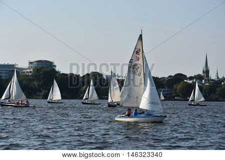 HAMBURG, GERMANY - AUG 26: Sailboats on Lake Alster in Hamburg, Germany, as seen on Aug 26, 2016. Hamburg was founded at the mouth of Alster river in the 9th century and has been used as a port since.