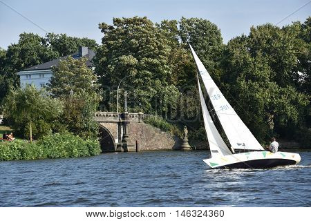 HAMBURG, GERMANY - AUG 26: Sailboats on Lake Alster in Hamburg, Germany, as seen on Aug 26, 2016. Hamburg was founded at the mouth of Alster river in the 9th century and has been used as a port since.