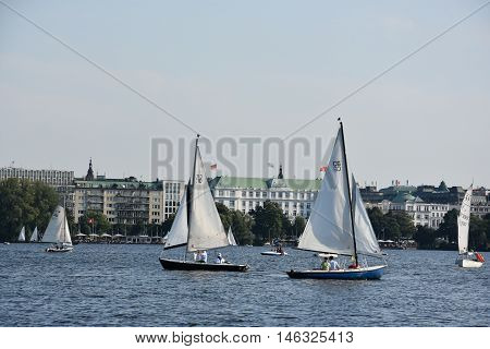HAMBURG, GERMANY - AUG 26: Sailboats on Lake Alster in Hamburg, Germany, as seen on Aug 26, 2016. Hamburg was founded at the mouth of Alster river in the 9th century and has been used as a port since.