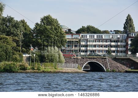 HAMBURG, GERMANY - AUG 26: Bridge on Lake Alster in Hamburg, Germany, as seen on Aug 26, 2016. Hamburg was founded at the mouth of Alster river in the 9th century and has been used as a port since.